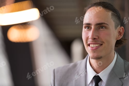 Preview: Happy Young Businessman Thinking