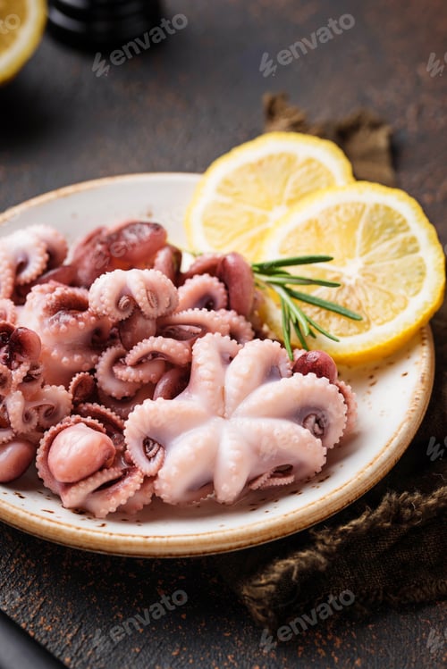 Preview: Baby octopus in plate with lemon and rosemary