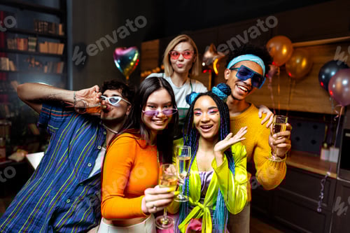 Preview: Group of friends making party at home on new year evening