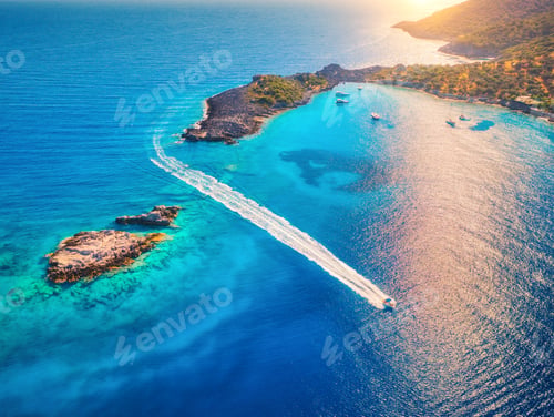 Preview: Aerial view of beautiful speed boat on the sea at sunset