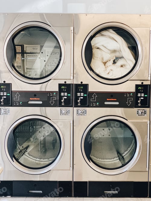 Preview: Clothes spinning in a dryer at a laundromat