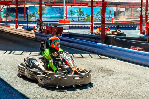 Preview: Young person driving racing go kart on track