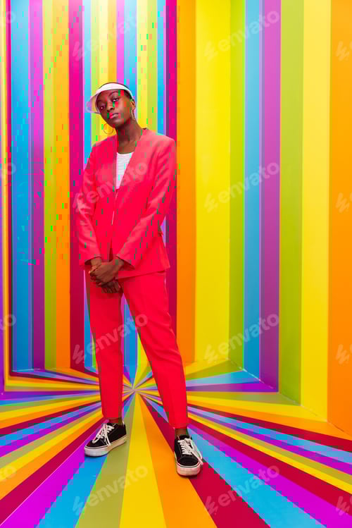 Preview: Beautiful young woman dancing and having fun inside a rainbow box room