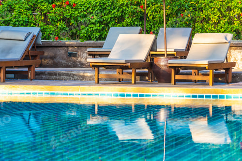 Preview: Umbrella and chair around swimming pool in hotel resort neary se
