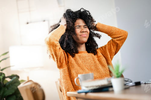 Preview: Tired african-american business woman with headache at home office, feeling sick at work