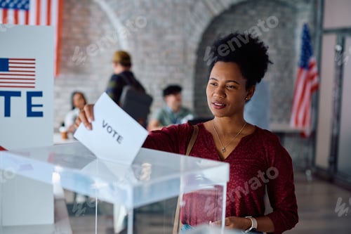 Preview: Black female citizen voting on US election day at the polling place.