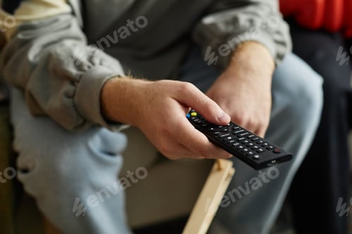 Preview: Close Up of Hand Holding TV Remote