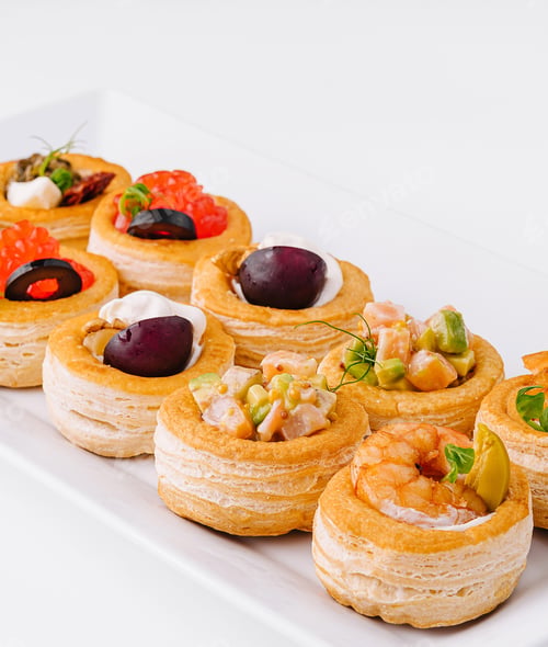 Preview: Gourmet assorted mini tartlets on white plate