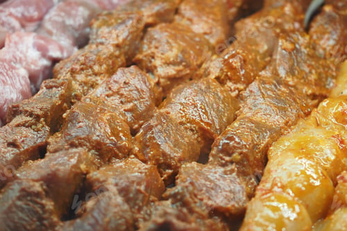 Preview: Grilled beef skewers at local market during evening hours