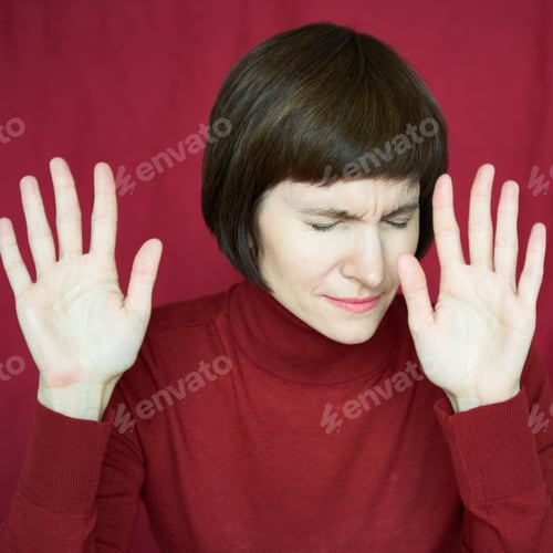 Preview: Portrait of mature woman in distress, hands up, stoping situation, stop gest. Agitated tensed face