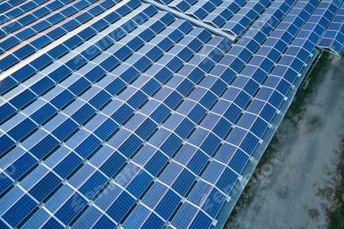 Preview: Aerial view of solar power plant with blue photovoltaic panels
