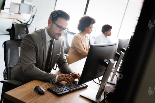 Preview: Programmers cooperating at IT company developing apps