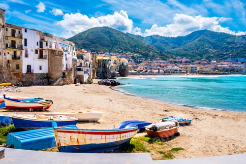 Preview: Fishing boats on beach of Cefalu, medieval town on Sicily island, Italy
