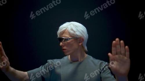 Preview: Future man wearing metaverse glasses closeup. Focused gamer enjoying simulation