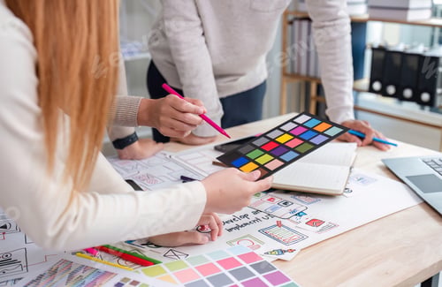 Preview: Creative team of designers in application design and ux ui usability planning. Modern business team