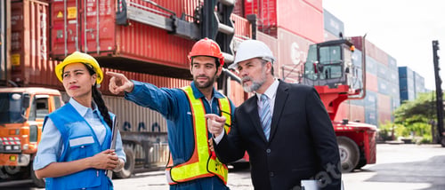 Preview: Businessman, Engineer or foreman talking and checking inventory or task details at container yard.