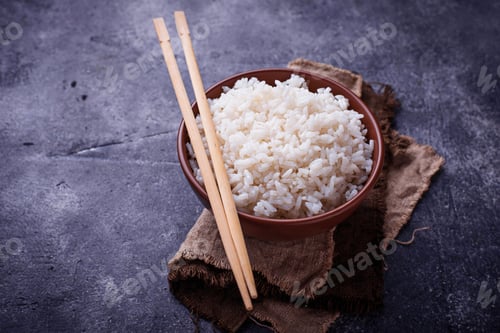 Preview: Bowl of boiled rice and chopsticks