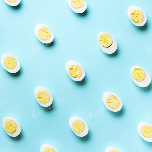 Preview: Food concept with boiled eggs pattern on blue background. Top view. Creative pattern in minimal