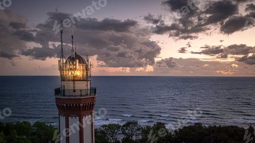 Preview: Light beam from lighthouse by Sea in Poland after sunset.