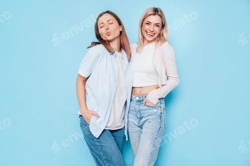 Preview: Two Smiling Women Posing Together in Studio