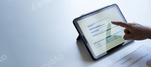 Preview: Cropped shot young businessman working while using digital tablet, preparing for the company meet.