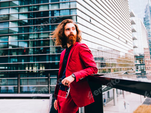 Man with Beard Posing in Red Suit