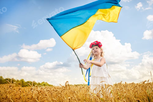 Preview: girl holding flag of Ukraine. Blue yellow flag of Ukraine with coat of arms in hands of child on
