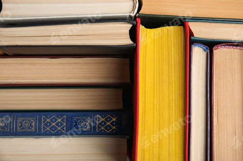 Preview: Stack of hardcover books as background, closeup