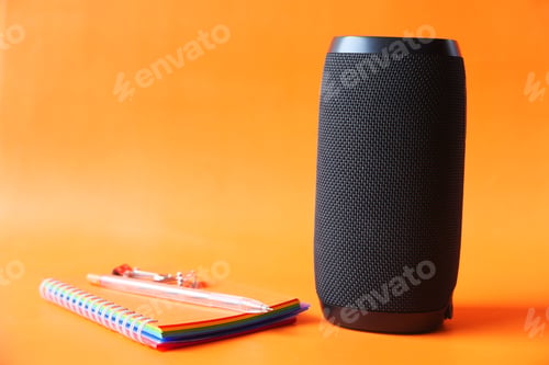 Preview: smart speaker and keyboard with copy space on orange background background