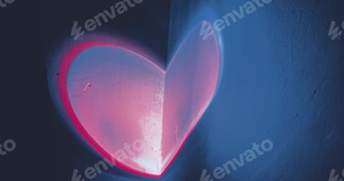 Preview: Colorful light heart shape projected in a wall
