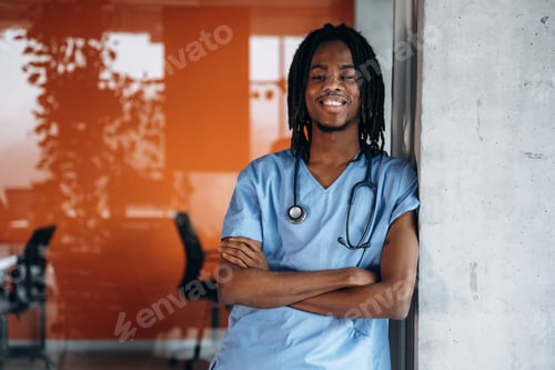 Preview: Arms crossed, standing. Black man doctor is in the office