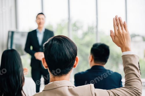 Preview: A conference audience with raised hands for questions, illustrating an interactive meeting. Group