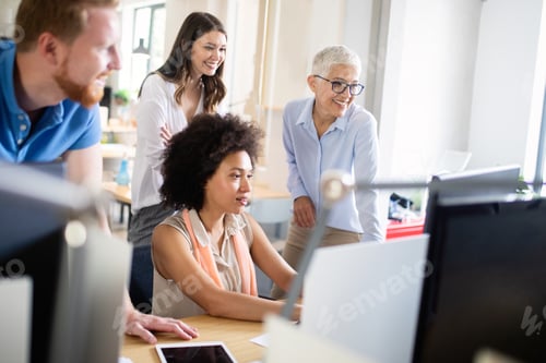 Preview: Cheerful coworkers in office during company meeting