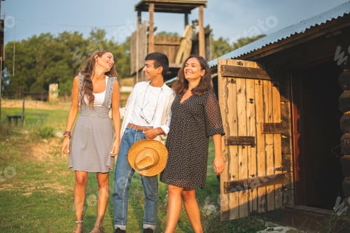 Preview: Friends Having Fun and Laughing Outside of The Wooden Wagon