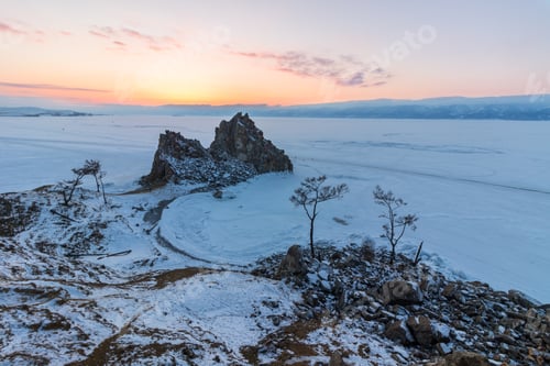 Preview: Shamanka rock in winter at sunset. Olkhon island, Baikal lake, Siberia, Russia