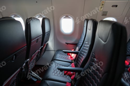 Preview: Empty passenger airplane seats in the cabin. Deserted economy class airplane seats rows.