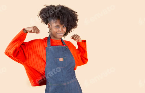 Preview: empowered woman in apron, working woman, beige background