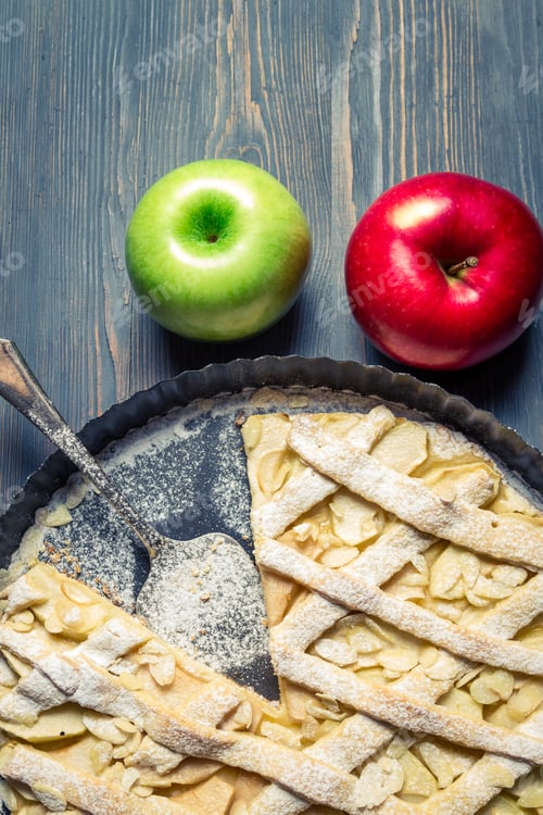Preview: Apples and freshly baked apple pie on old blue table
