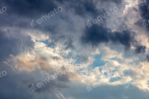 Preview: Cloud on blue sky background. Cloudscape grey and orange shade. Twilight light color the cloudy sky