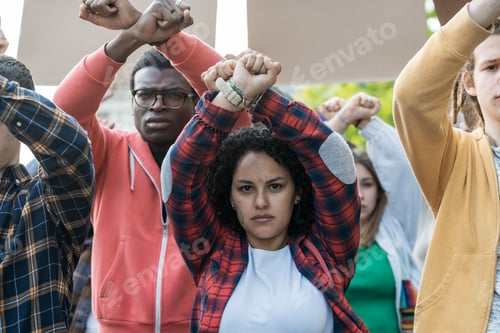 Preview: Diverse youth activists raise fists in unity: multicultural protest for social change