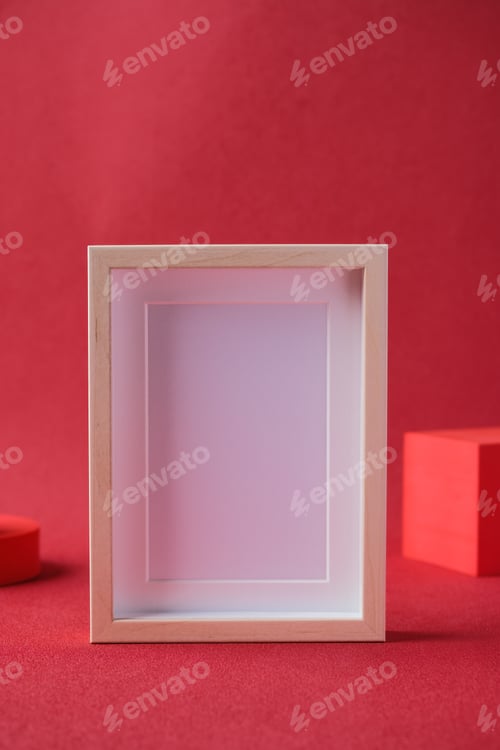 Preview: blank mockup photo freame with display block at red background studio