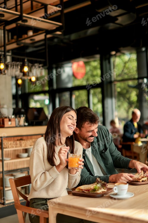 Preview: Enjoying a delightful brunch together at a cozy cafe on a sunny afternoon in the heart of the city
