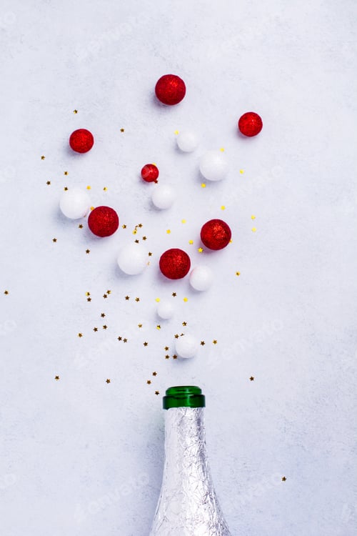 Preview: Christmas champagne bottle with sprinkles white color on white background. New year concept. Top vie