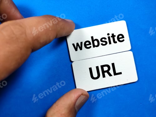 Preview: Hand holding wooden board written with text website URL on a blue background.