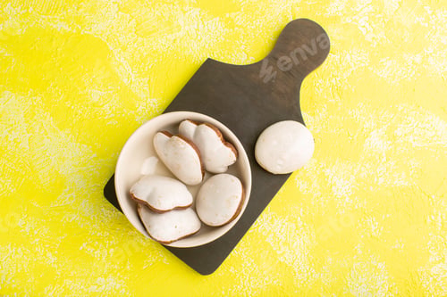 Preview: top view yummy formed cookies inside olate on the yellow background cookie biscuit sweet bake sugar