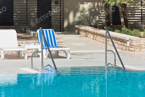 Preview: Hotel Poolside Chairs near a swimming pool