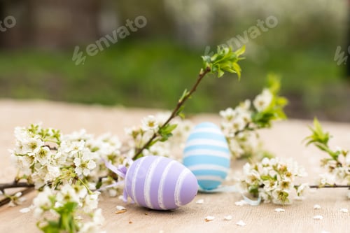 Preview: Colorful Easter eggs with spring blossom flowers. Colored Egg Holiday border.