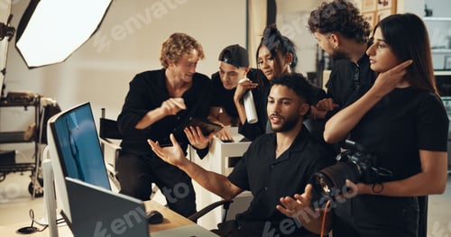 Preview: People, photographer and photoshoot review in studio for production results, talking and teamwork.