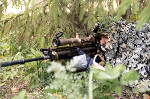 Preview: Sniper looking through rifle scope