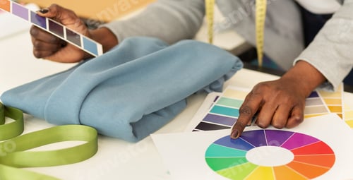 Preview: Female Designer Working With Fabric And Color Samples, Closeup
